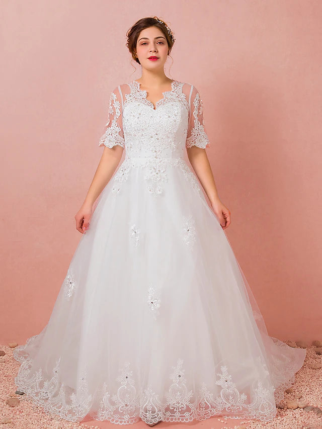 Elegant A-line wedding dress with V-neck, half sleeves, and cathedral train.