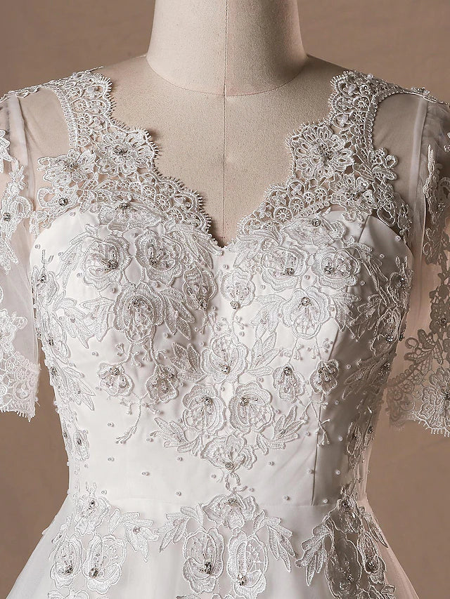 Bride wearing an elegant A-line satin wedding gown.