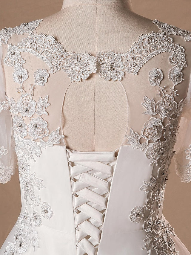 Side view of a V-neck half sleeve wedding dress.