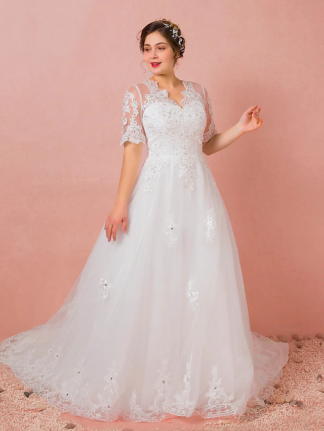 Detail of the half sleeves and V-neckline on a wedding gown.