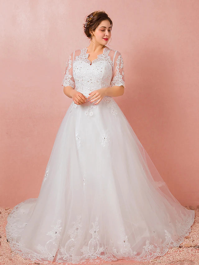 Satin wedding dress with intricate lace and crystal accents.