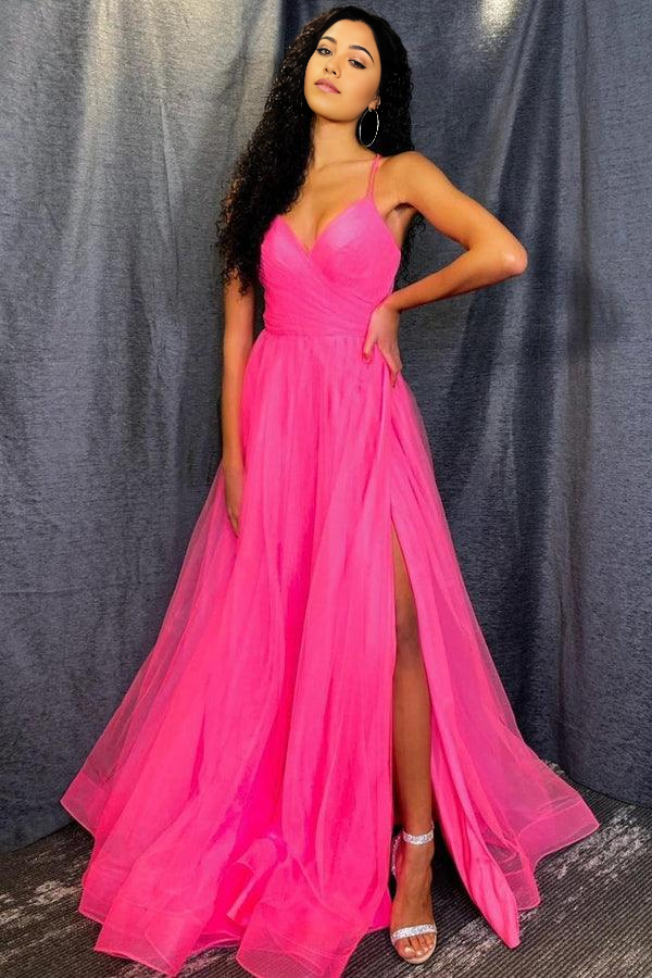 Model wearing a vibrant hot pink formal tulle gown.