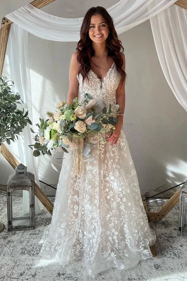 Elegant A-Line wedding dress with spaghetti straps and keyhole back.