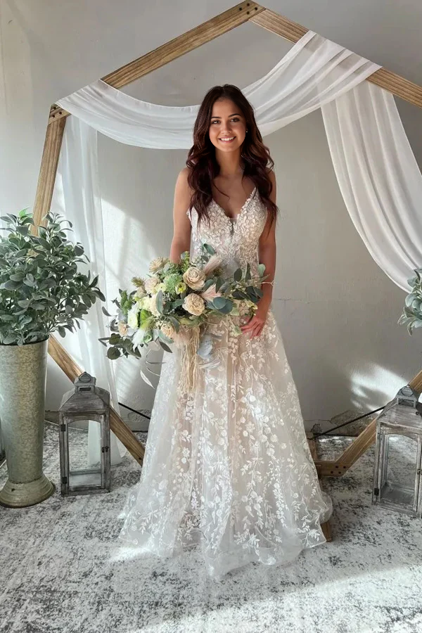 Side profile of A-Line bridal gown with flowing skirt.