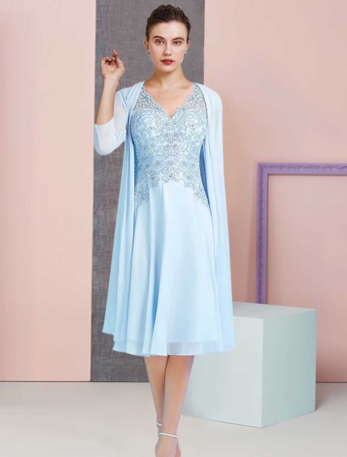 Elegant A-line mother of the bride dress with V-neck, 3/4 sleeve jacket, and sequin appliques.