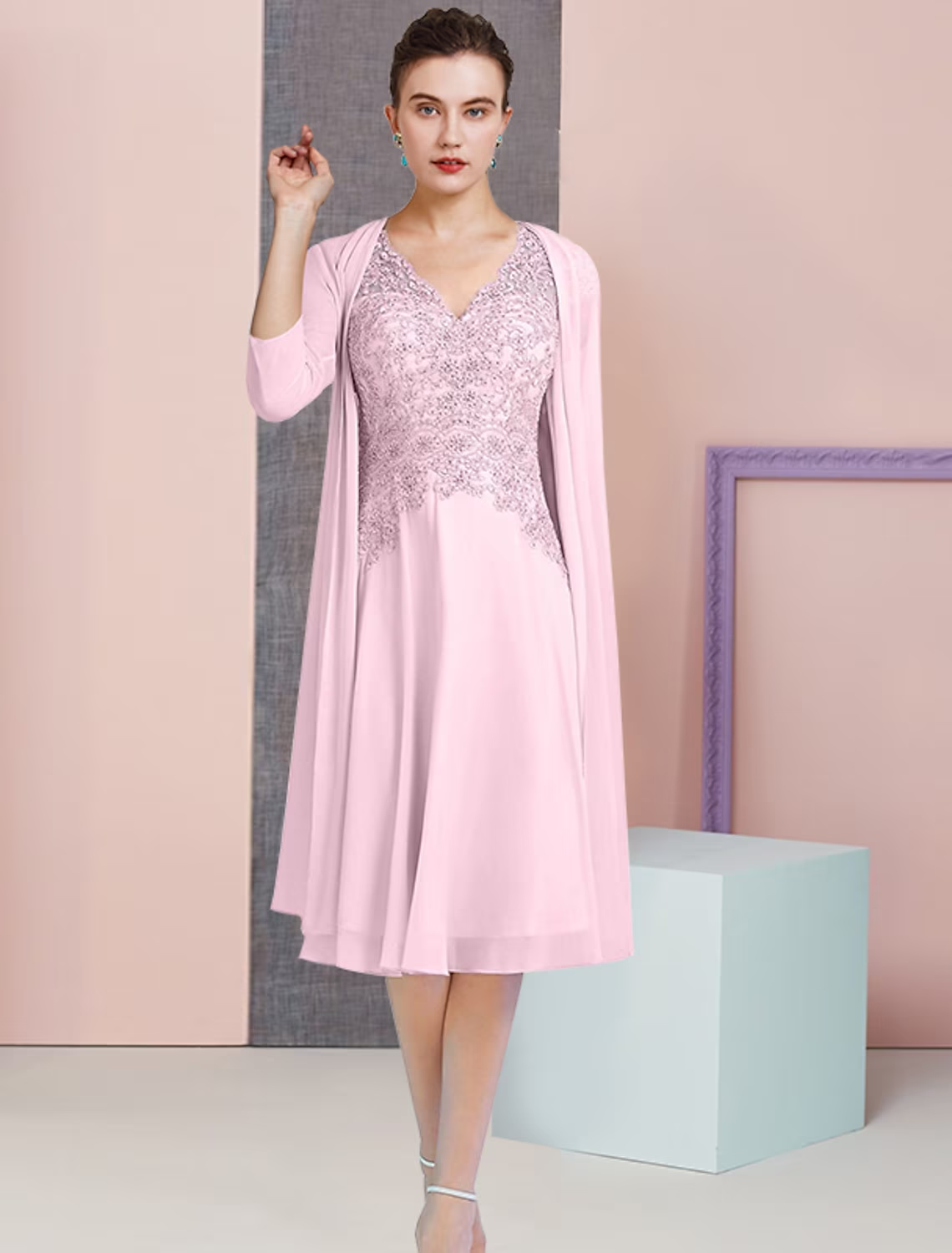Back view of the A-line mother of the bride dress, showcasing the knee-length design and chiffon fabric.