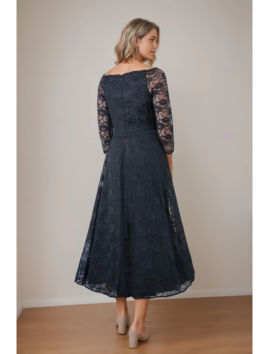 Back view of an elegant A-Line V-Neck lace tea length Mother of the Bride dress.