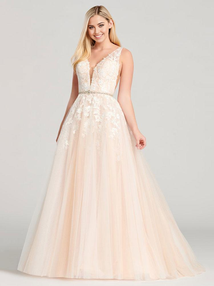 Woman in elegant A-line V-neck lace applique prom dress.