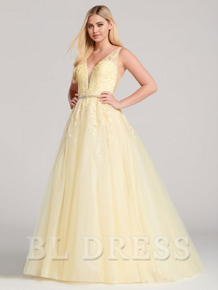 Side view of woman wearing a sleeveless A-line bridesmaid gown.