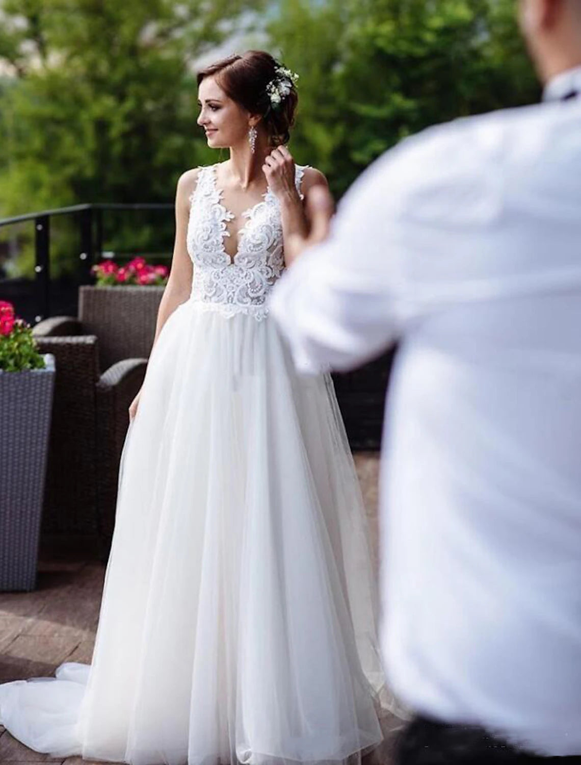Elegant A-line V-neck lace wedding dress with sweep train.