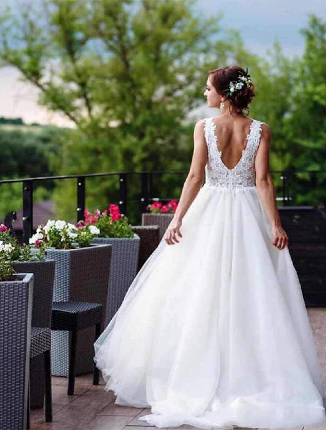 Back view of A-line lace wedding dress with delicate appliques.