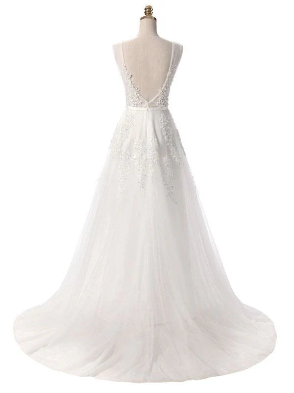 Close-up of intricate lace applique on a formal dress.