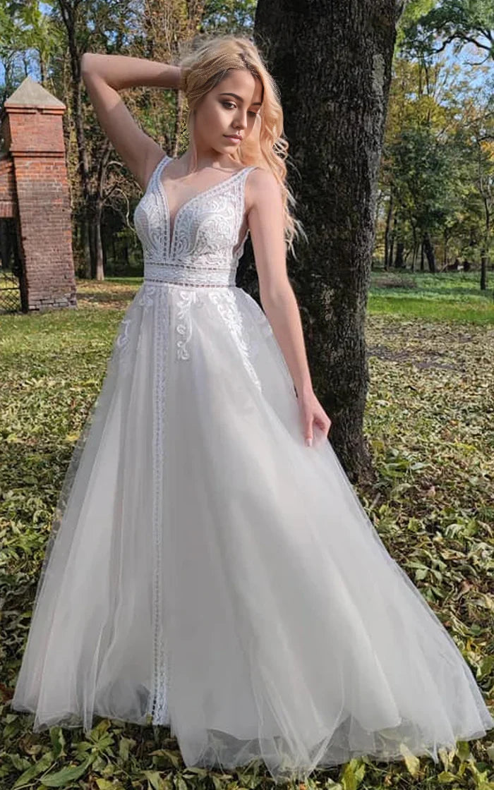 Elegant A-Line V-neck wedding dress with lace appliques and a low-V back.
