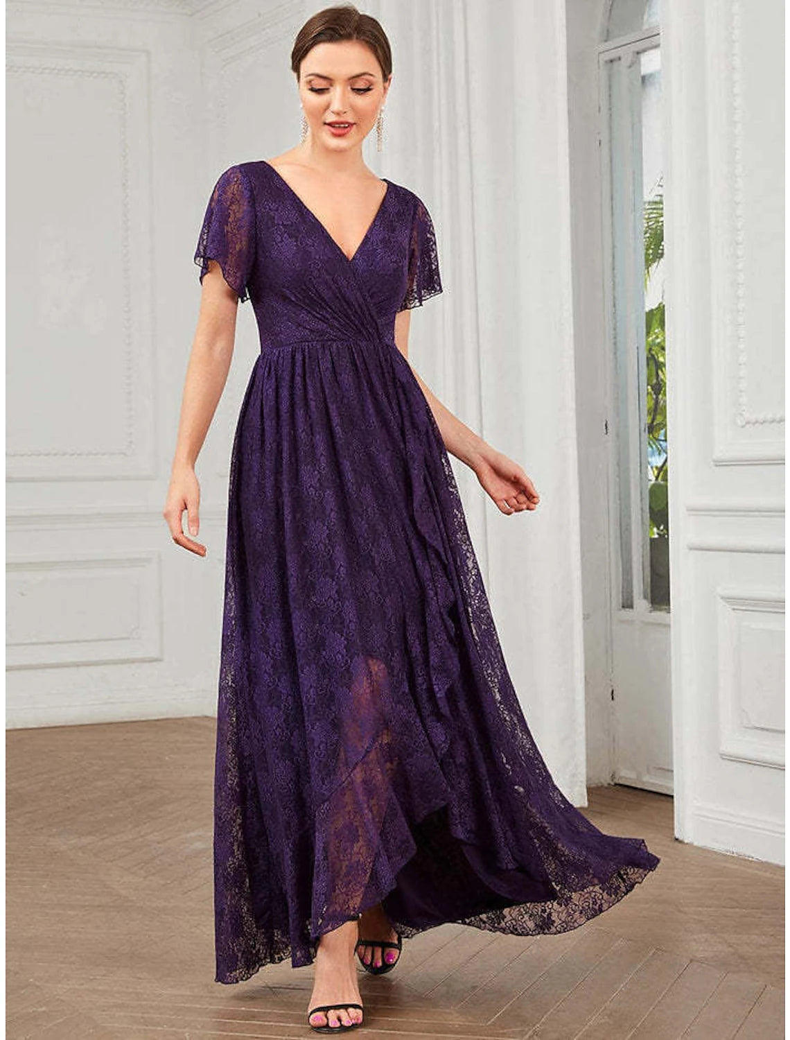 Woman walking in the A-line V-neck lace applique midi dress.