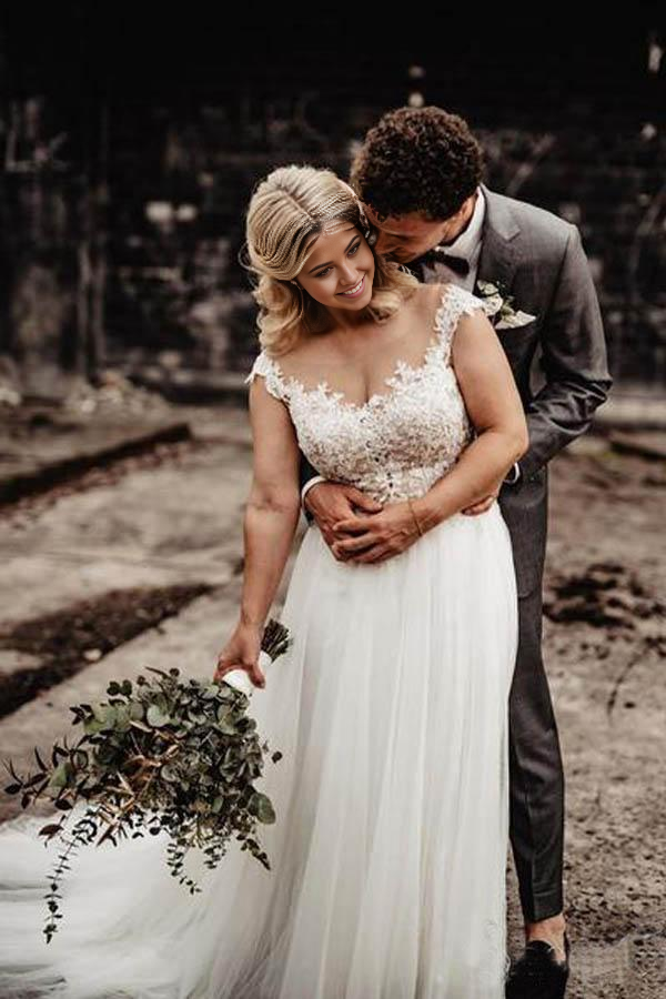 Front view of an elegant A-Line V-neck wedding gown with delicate lace appliqués.