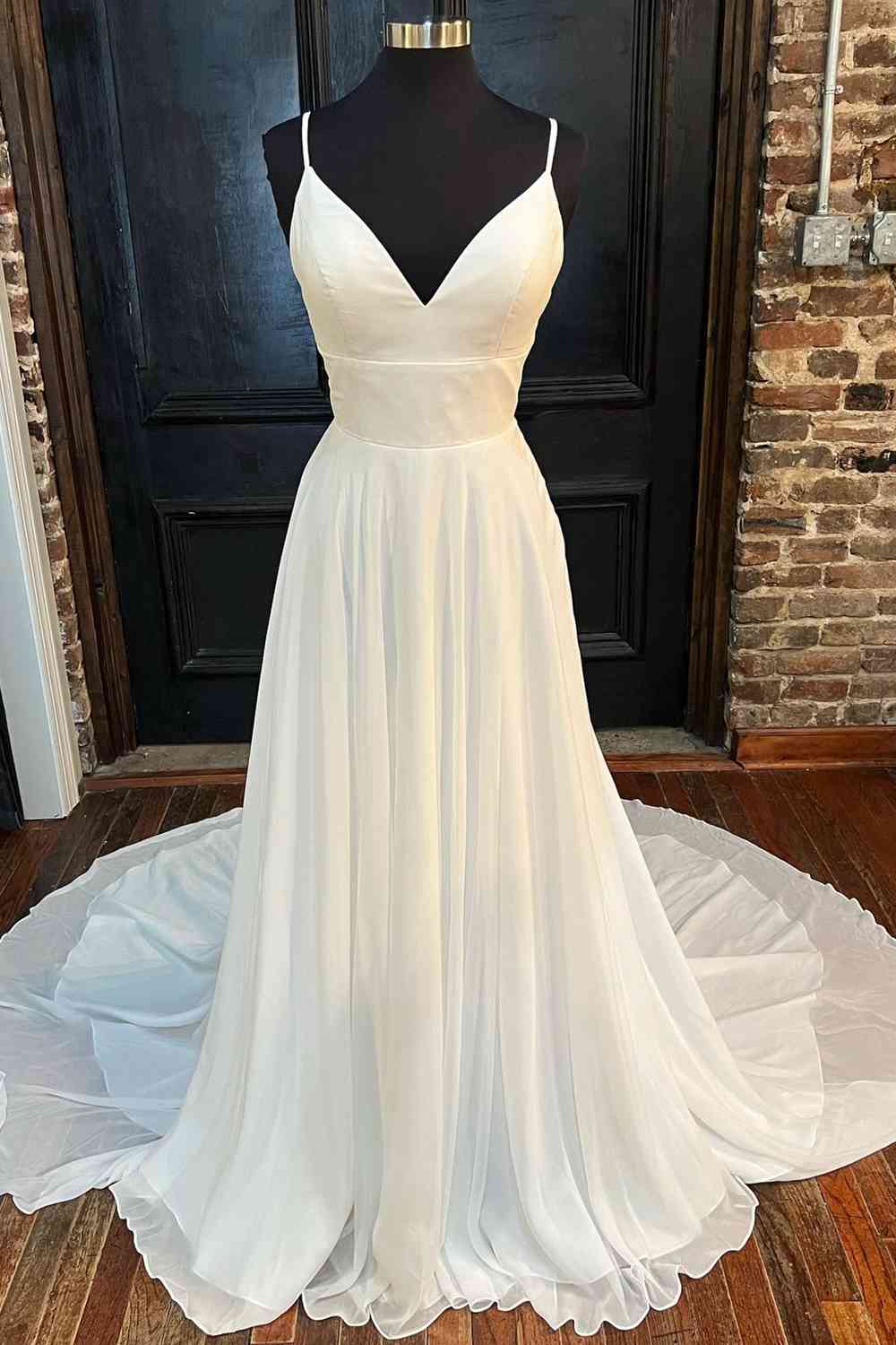Elegant A-Line V-neck wedding dress with delicate lace back detail.