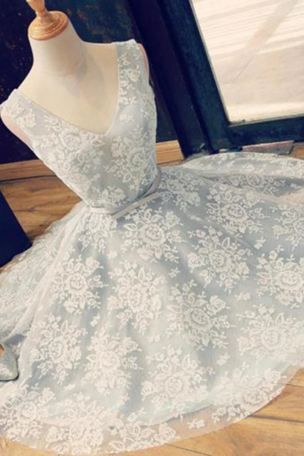Front view of an A-line V-neck lace backless homecoming dress with a belt.