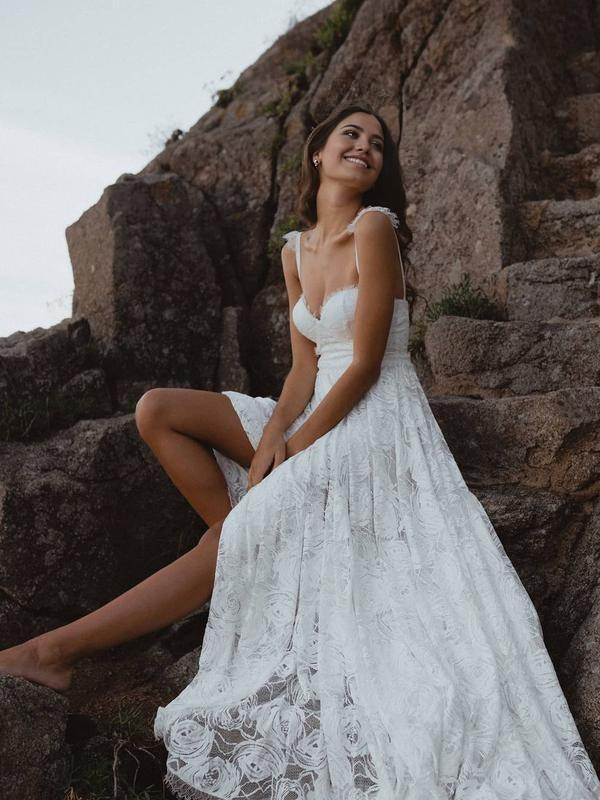 Full view of an elegant A-Line V-Neck lace wedding dress.