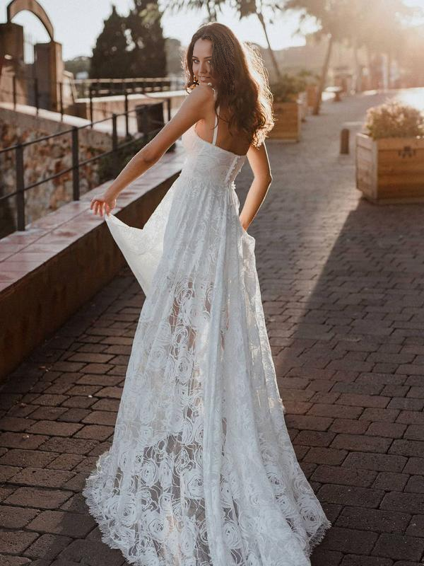 Close-up of the delicate lace detail on the V-Neck wedding dress.