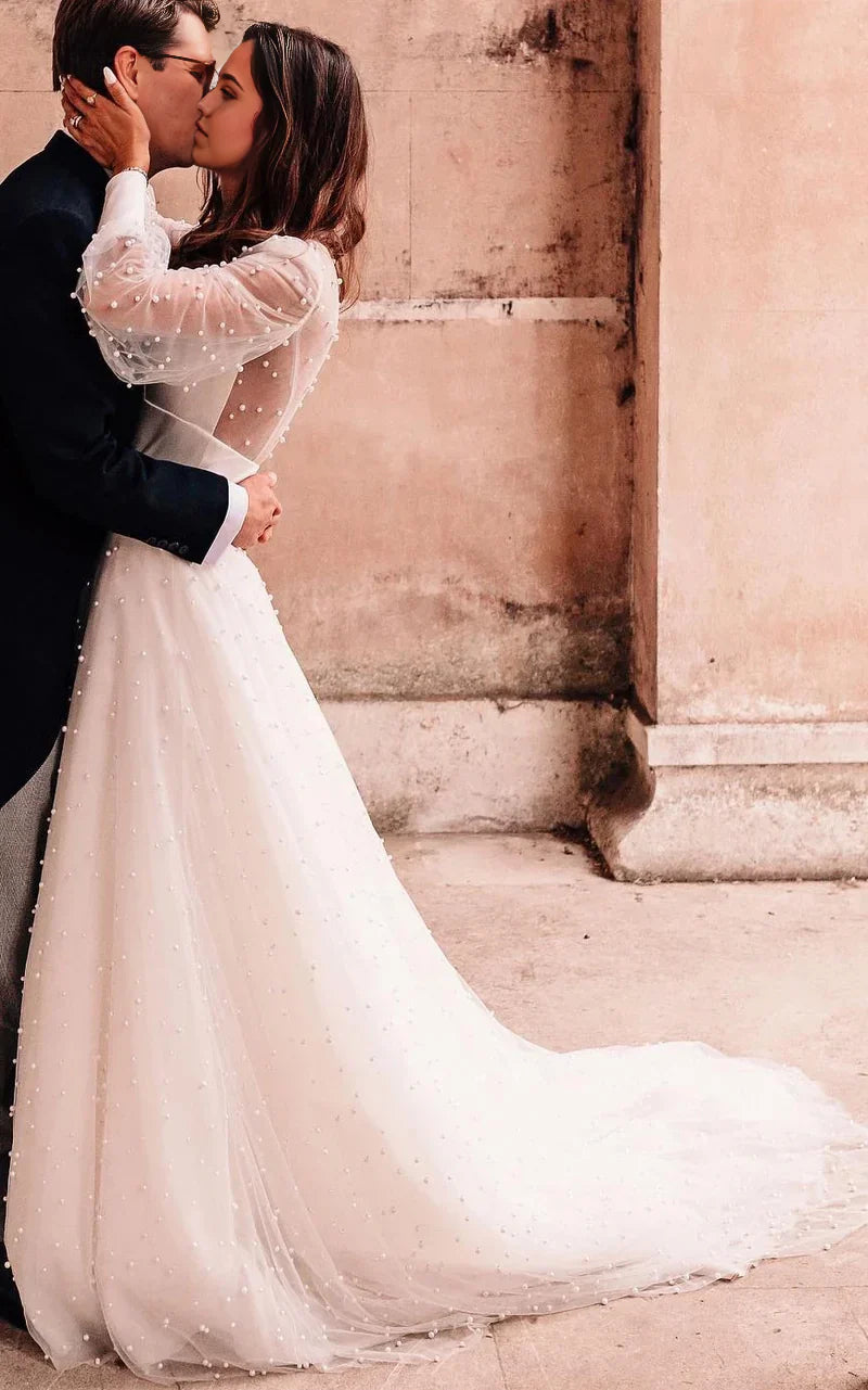 Back view of the A-line lace wedding dress featuring an open design.