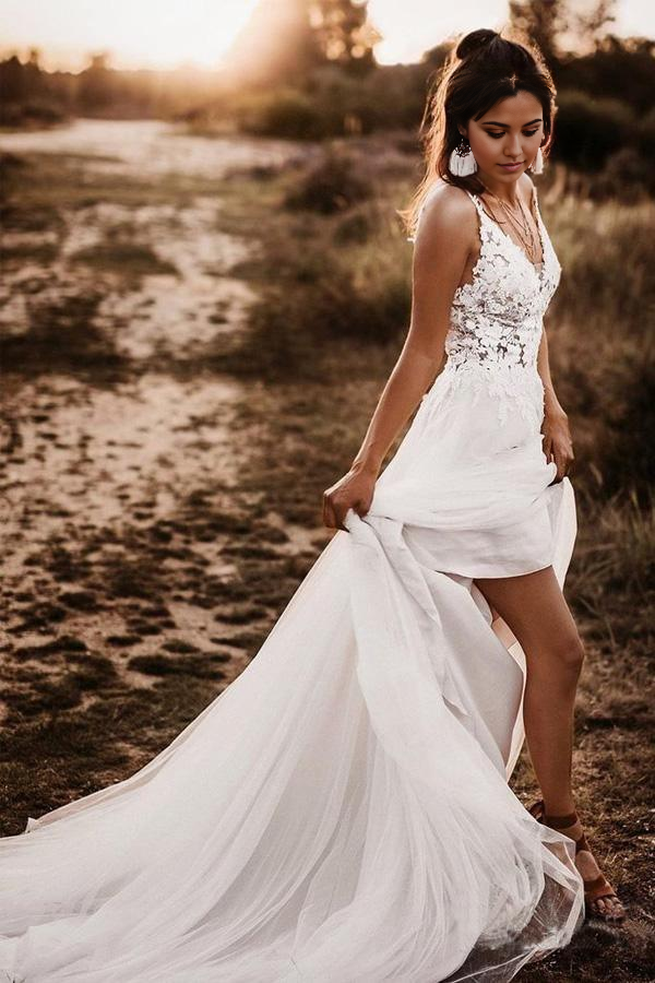 Elegant ivory A-line V-neck wedding dress with lace bodice.