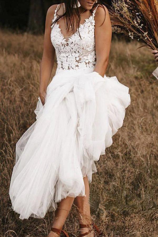 Back view of the ivory A-line wedding dress, showcasing the backless design.