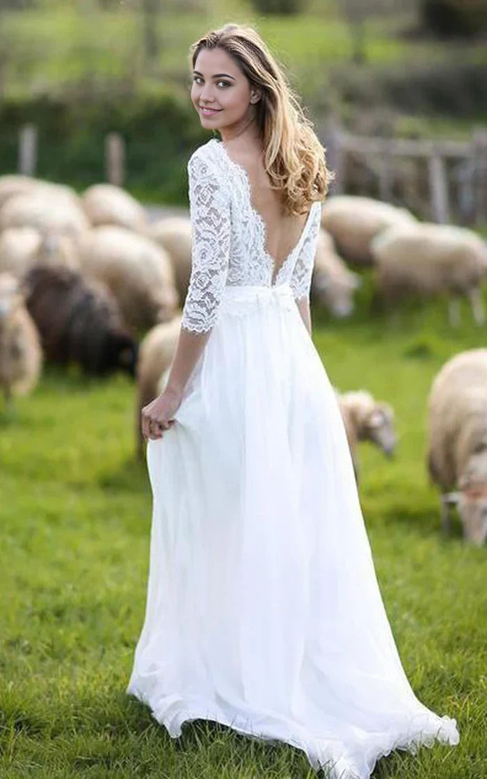 Back view of a floor-length A-line V-neck lace chiffon wedding gown.