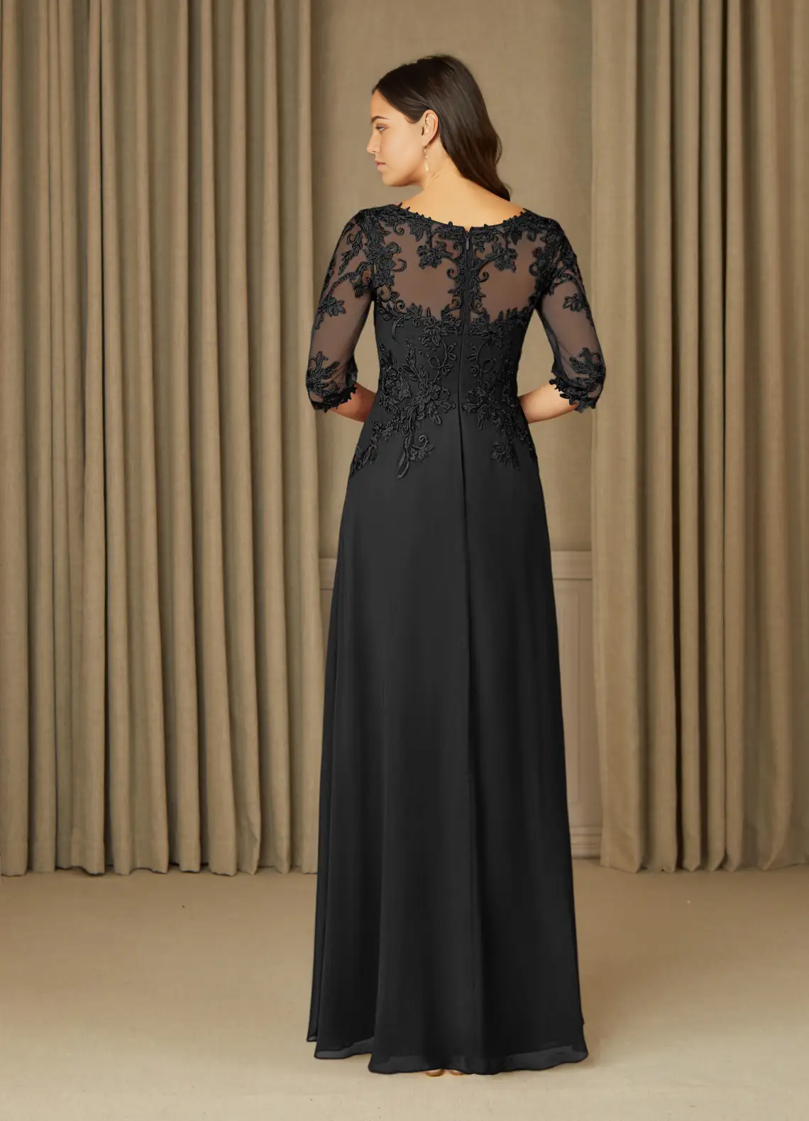 Elegant black V-neck formal gown with intricate appliques.