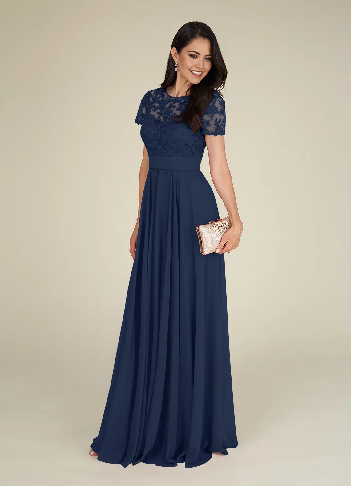 Close-up of lace and chiffon fabric on a dark navy formal dress.