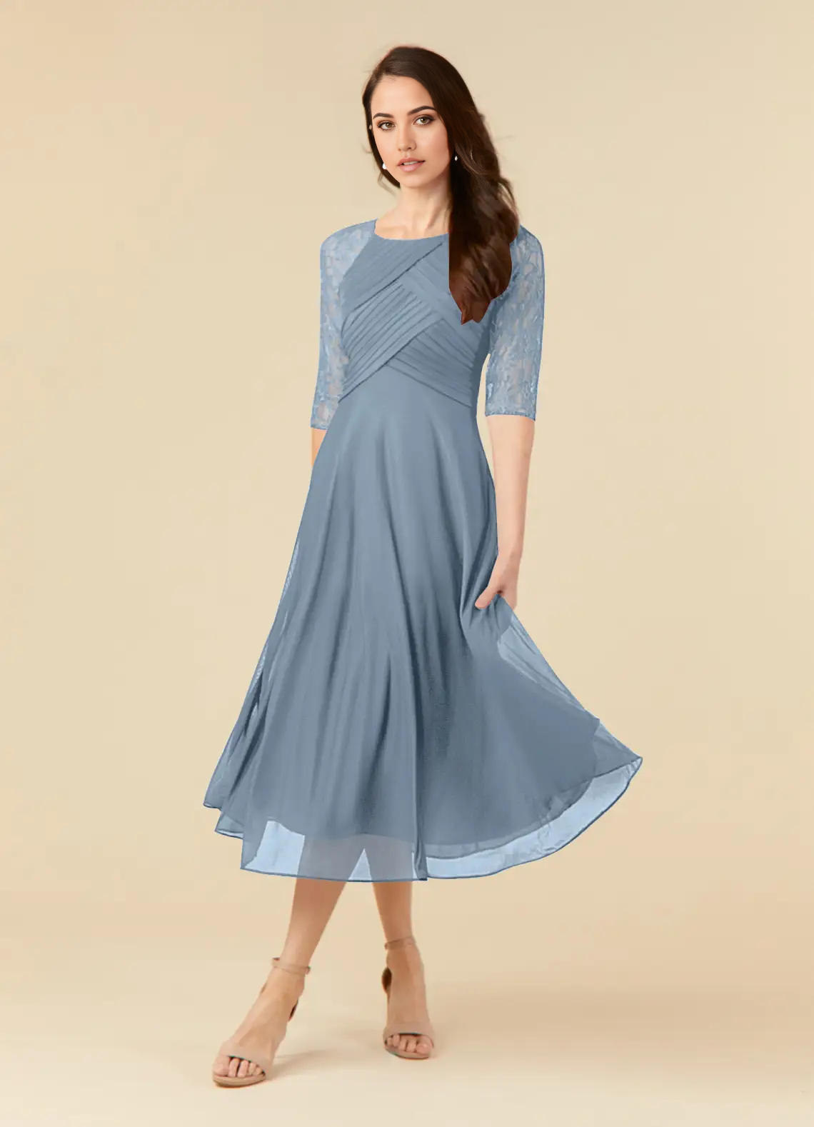 Woman wearing a dusty blue A-line lace tea length formal dress.