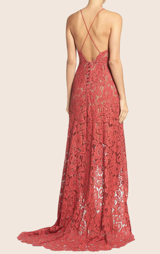 Back view of a woman wearing an A-line high-low lace formal dress.
