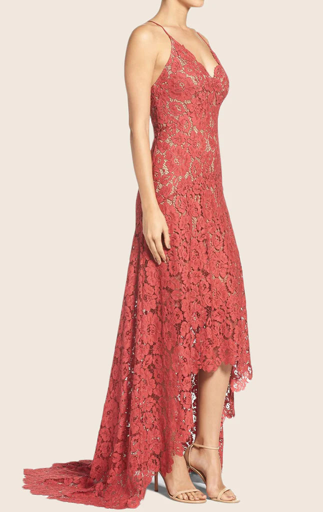Close-up of the lace and high-low hemline on a spaghetti strap prom dress.