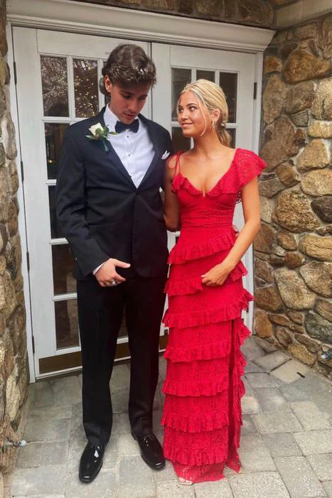Woman wearing an elegant A-line V-neck lace long prom dress.