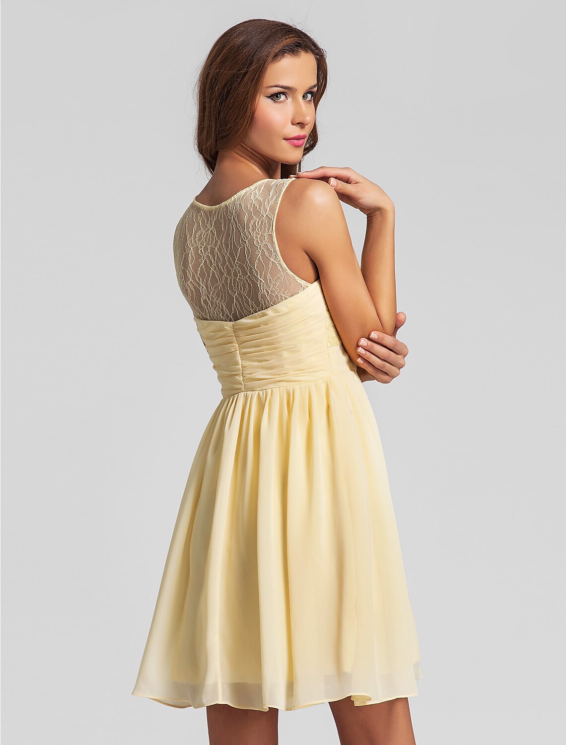 Full length view of a short chiffon bridesmaid dress.