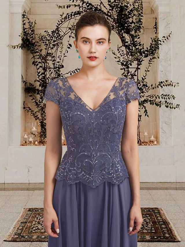 Back view of an A-line mother of the bride dress showing pleats and floor length.