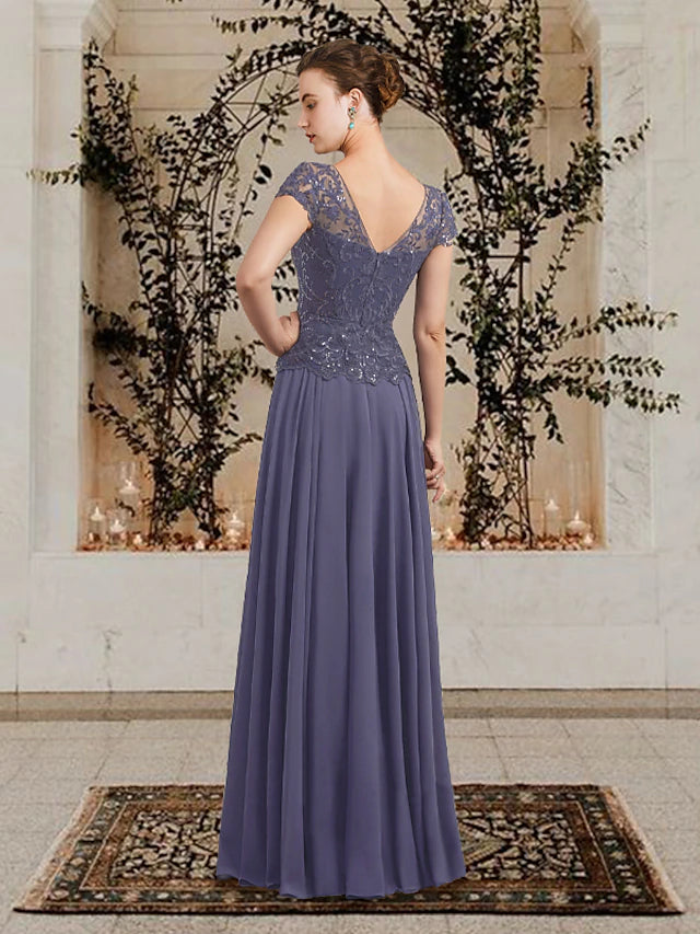 Close-up of the lace and sequin details on an A-line V-neck dress.