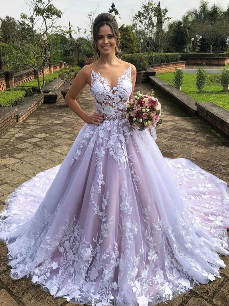 Woman wearing an elegant A-line V-neck lace wedding dress.