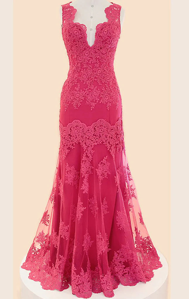Woman wearing an elegant V-neck lace long prom dress with spaghetti straps.