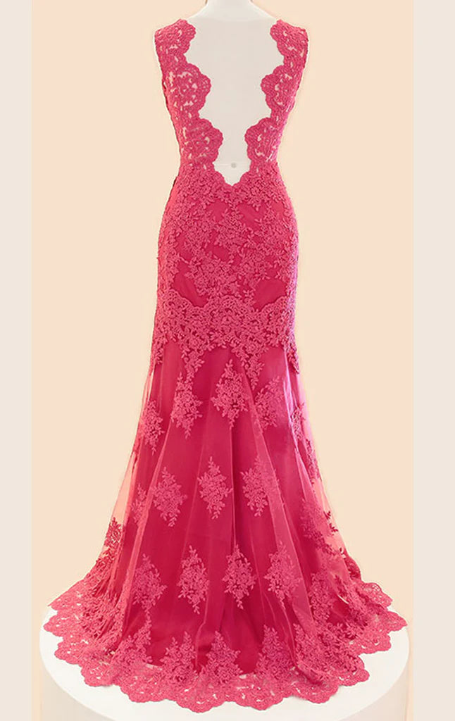 Close-up of the back of a lace formal gown, showing intricate lace and delicate straps.