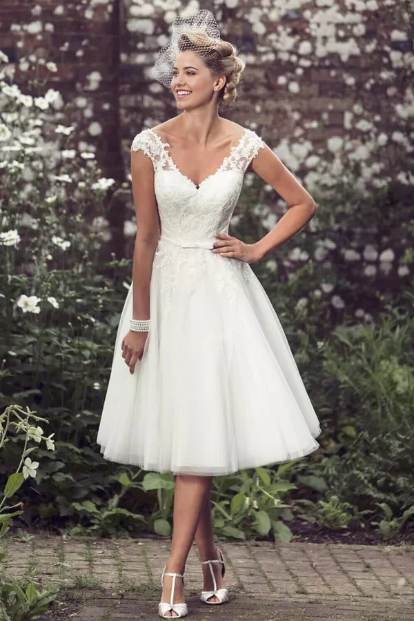 Elegant A-line lace tea length wedding dress with V-neck.