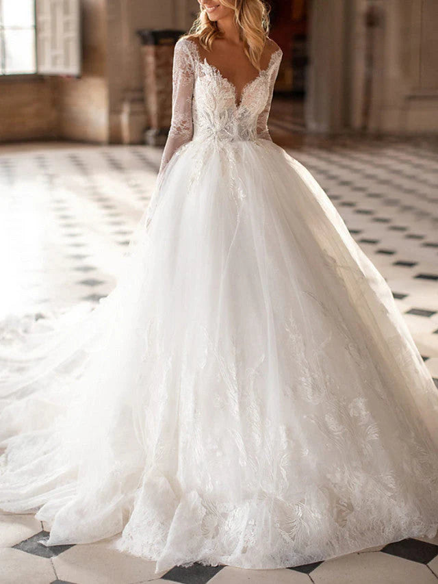 Intricate lace and soft tulle details on the sleeves of a wedding gown.