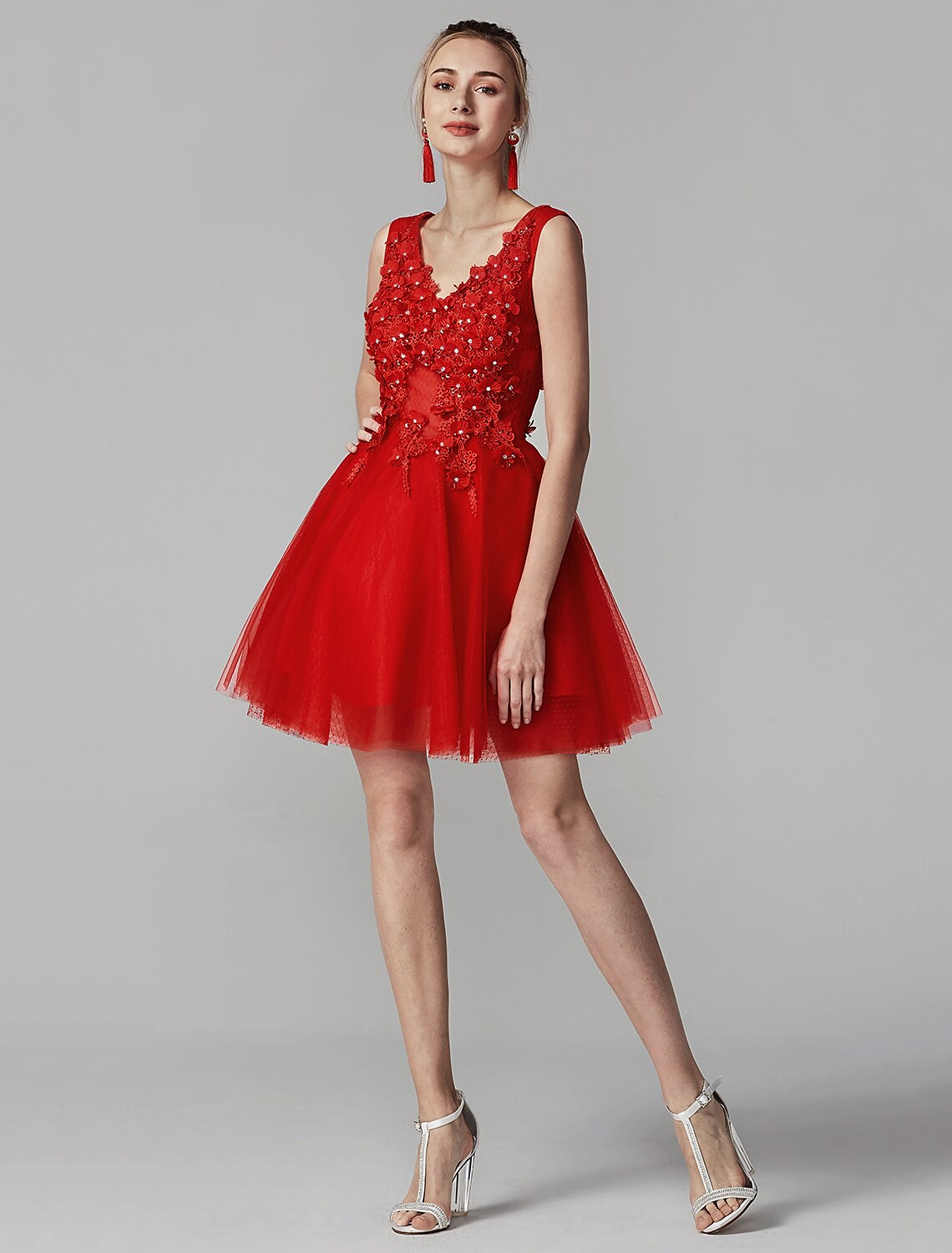 Model wearing a short A-line V-neck homecoming dress.