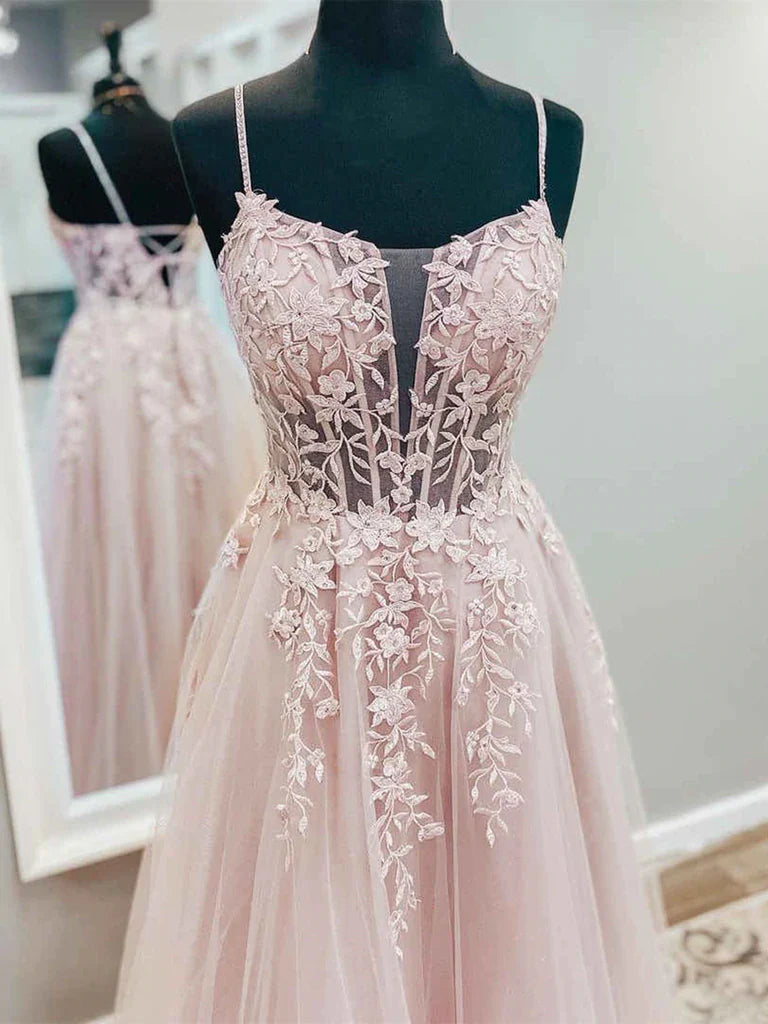 Woman wearing an elegant A-line V-neck tulle lace long prom dress.