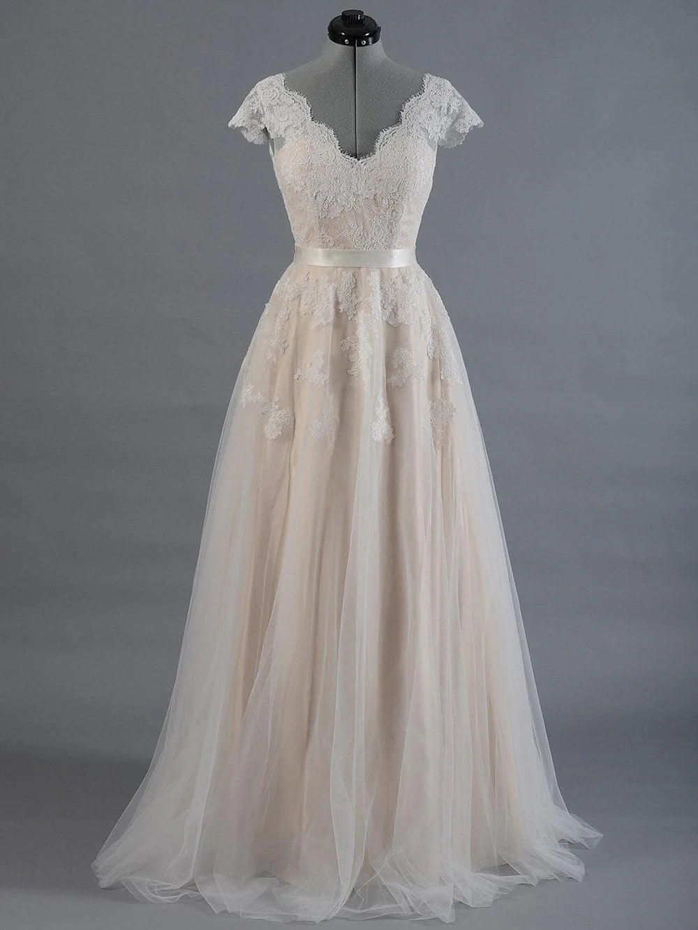 Elegant V-neck lace and tulle wedding dress, front view.