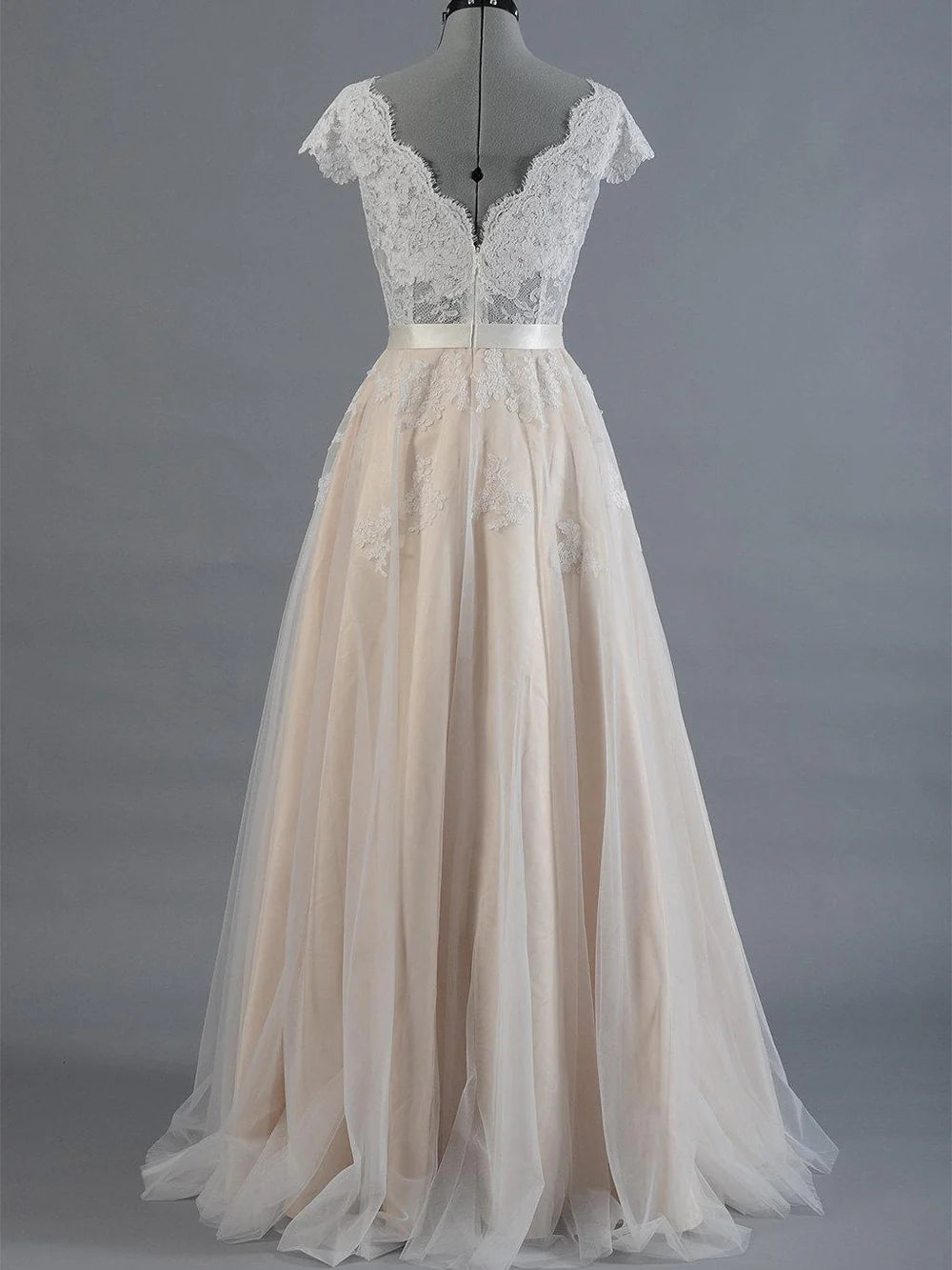 Close-up of delicate lace bodice on wedding gown.