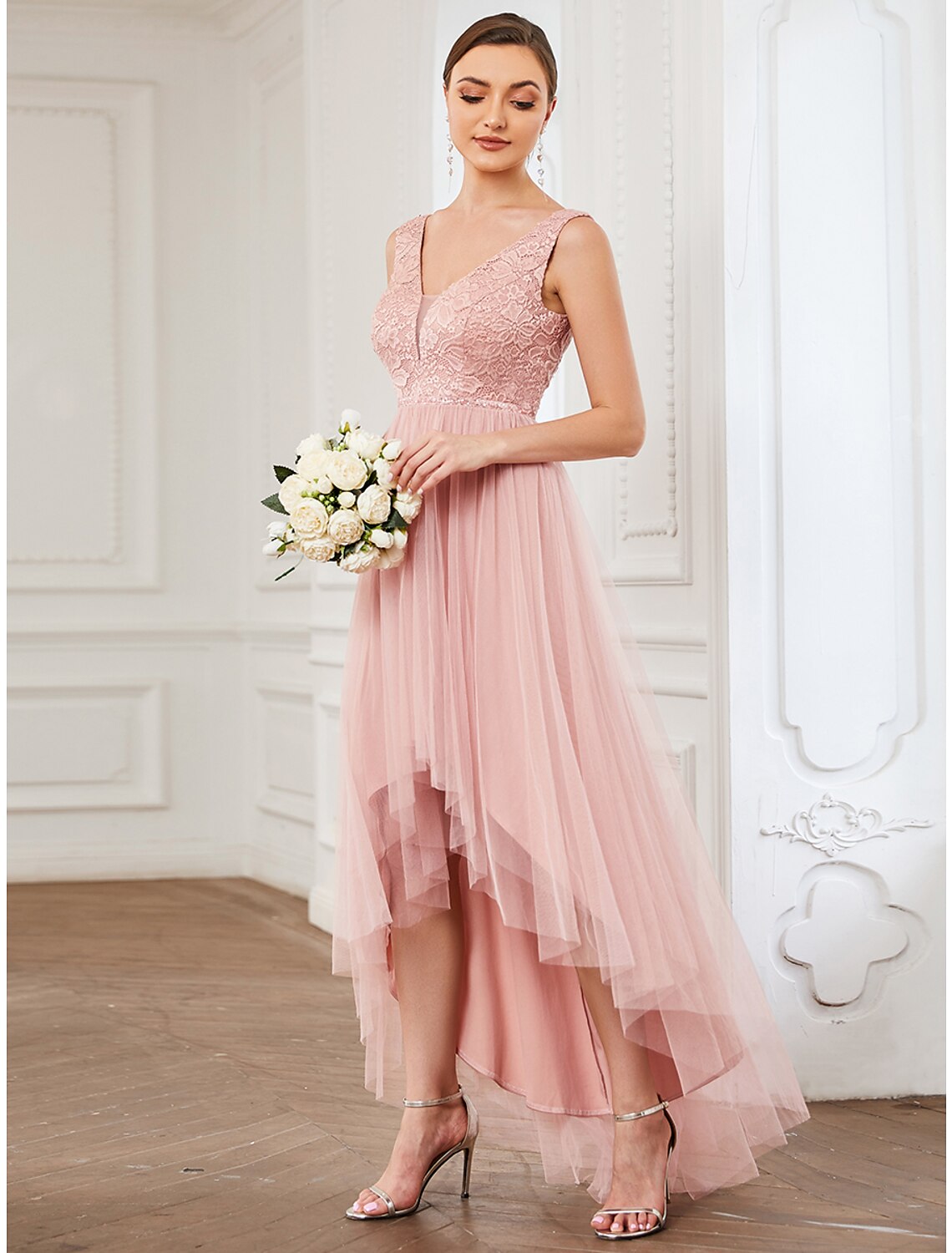 Close-up of the V-neckline and lace bodice on a tulle bridesmaid dress.
