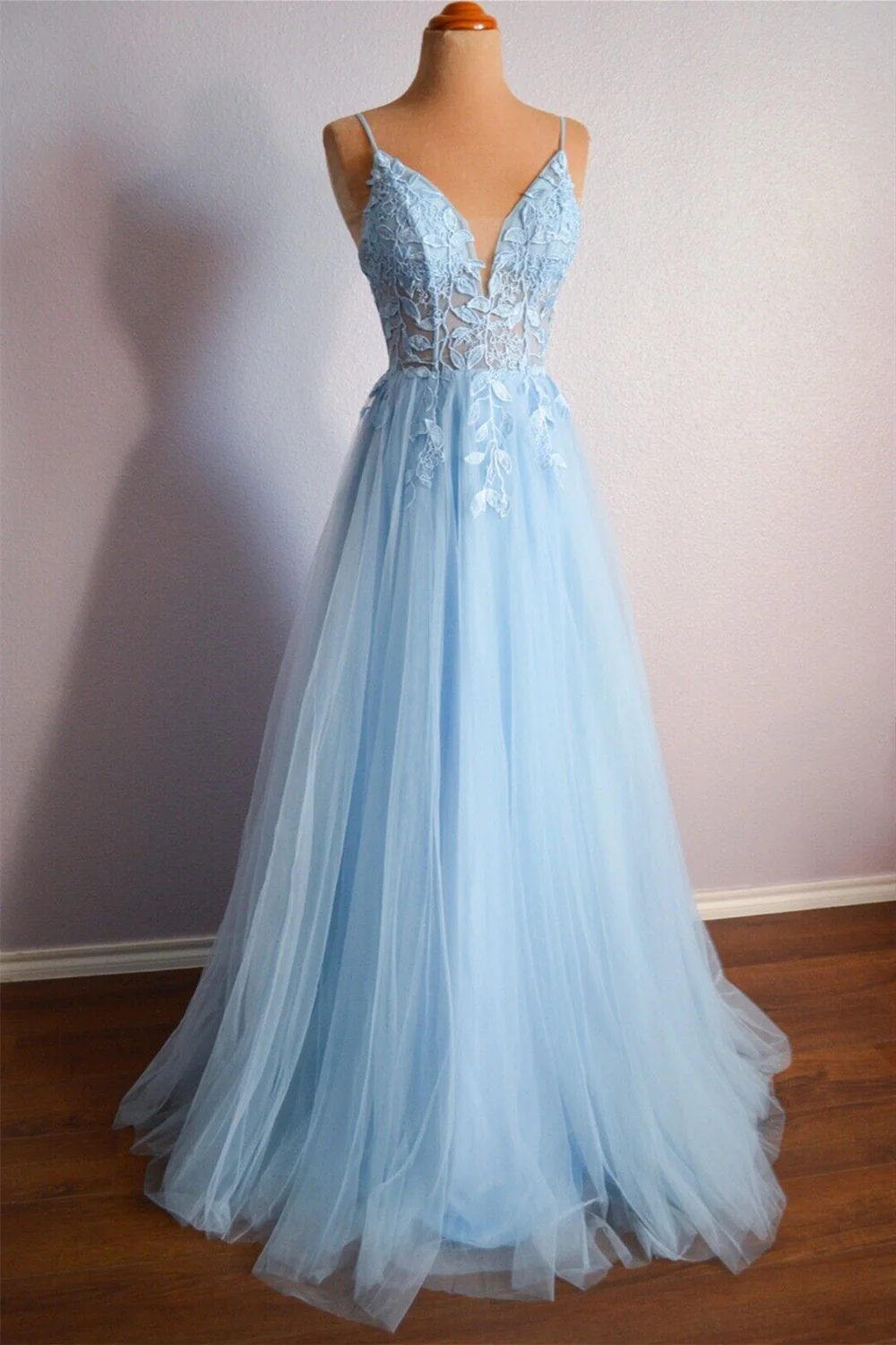 Elegant V-neck A-line prom dress with lace-up back and floral appliques.