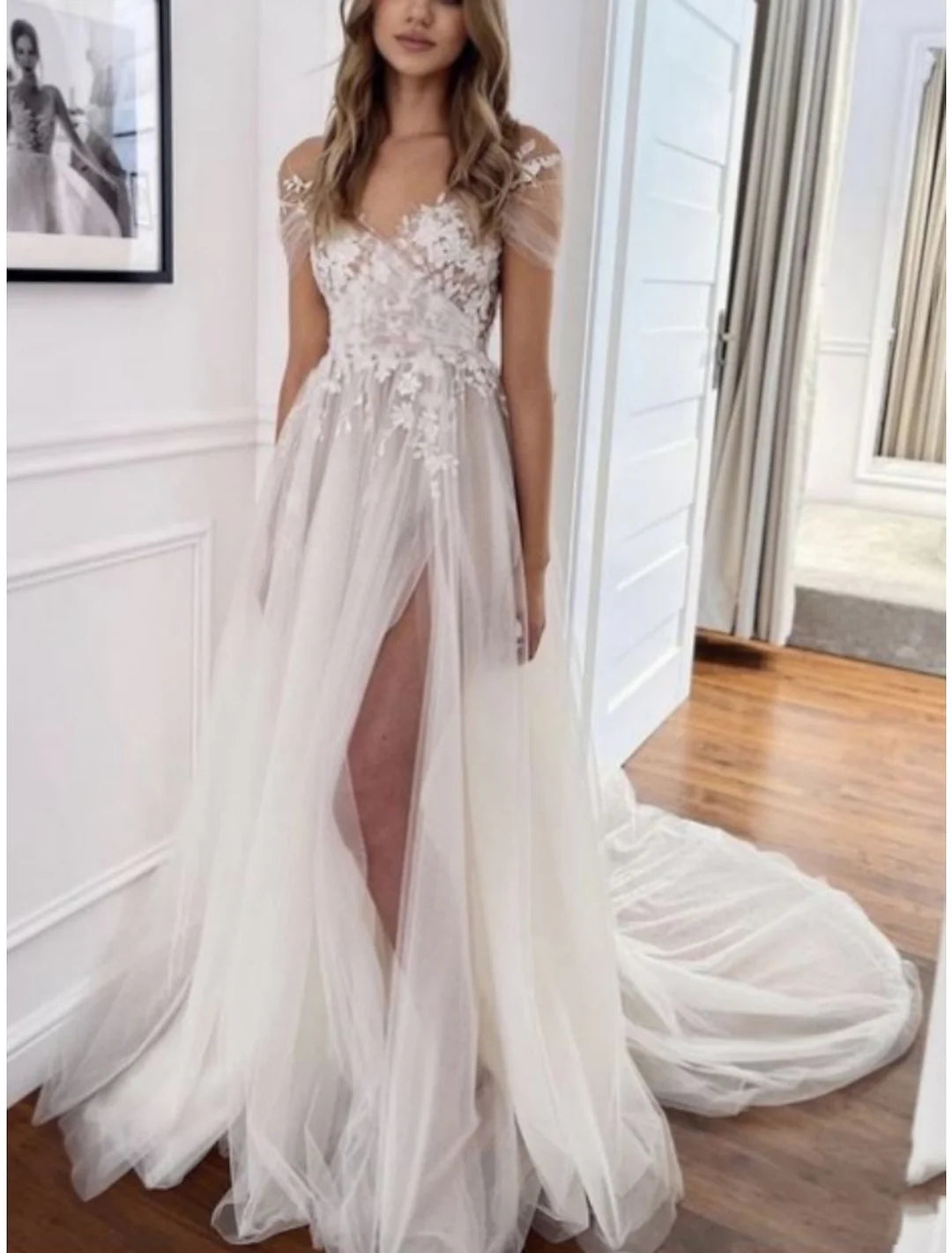 Elegant A-Line V-Neck lace wedding dress with a floor-length skirt and intricate detailing.