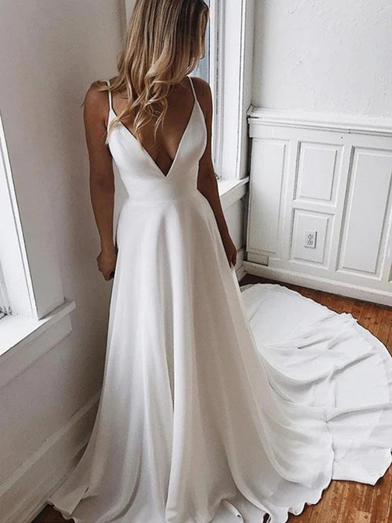 Full-length A-line V-neck lace wedding dress in white.