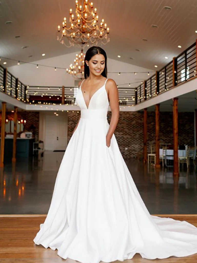 Full-length view of an elegant A-line V-neck white lace long evening dress.